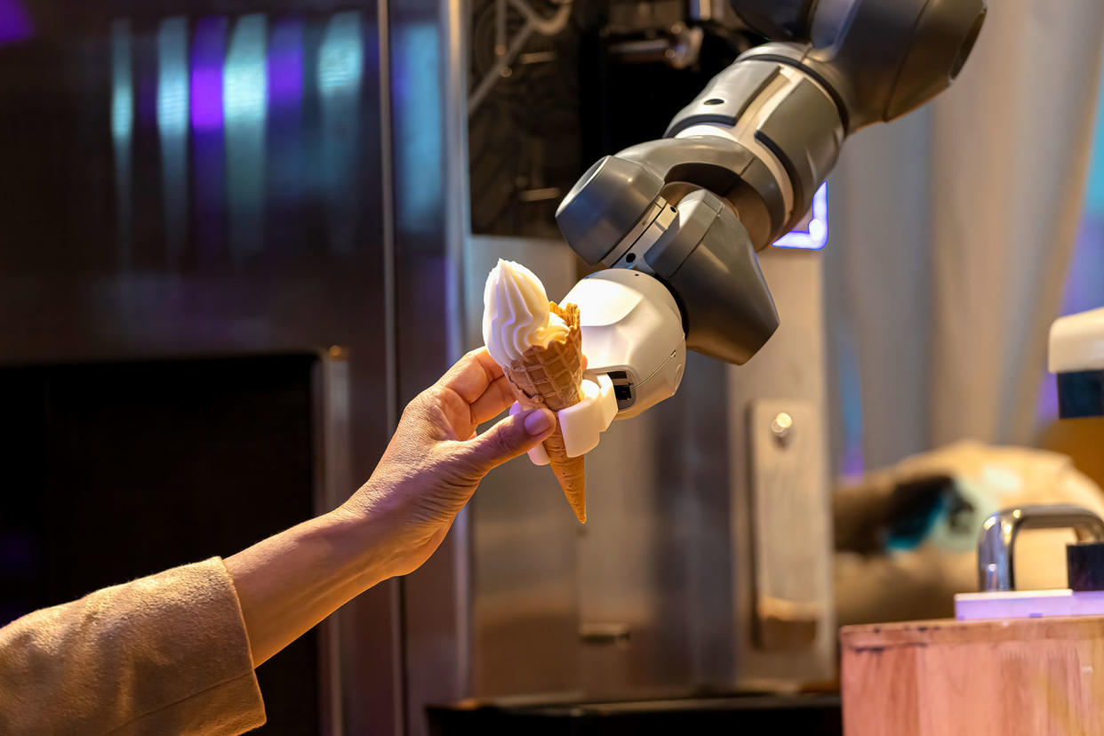 Robot arm serving ice cream Getty Images/chuchart duangdaw