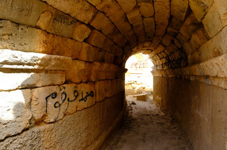 Graffiti on the ancient ruins of the Greek and Roman city of Cyrene, is seen in Shahhat, Libya October 20, 2018. Picture taken October 20, 2018. REUTERS/Esam Omran Al-Fetori