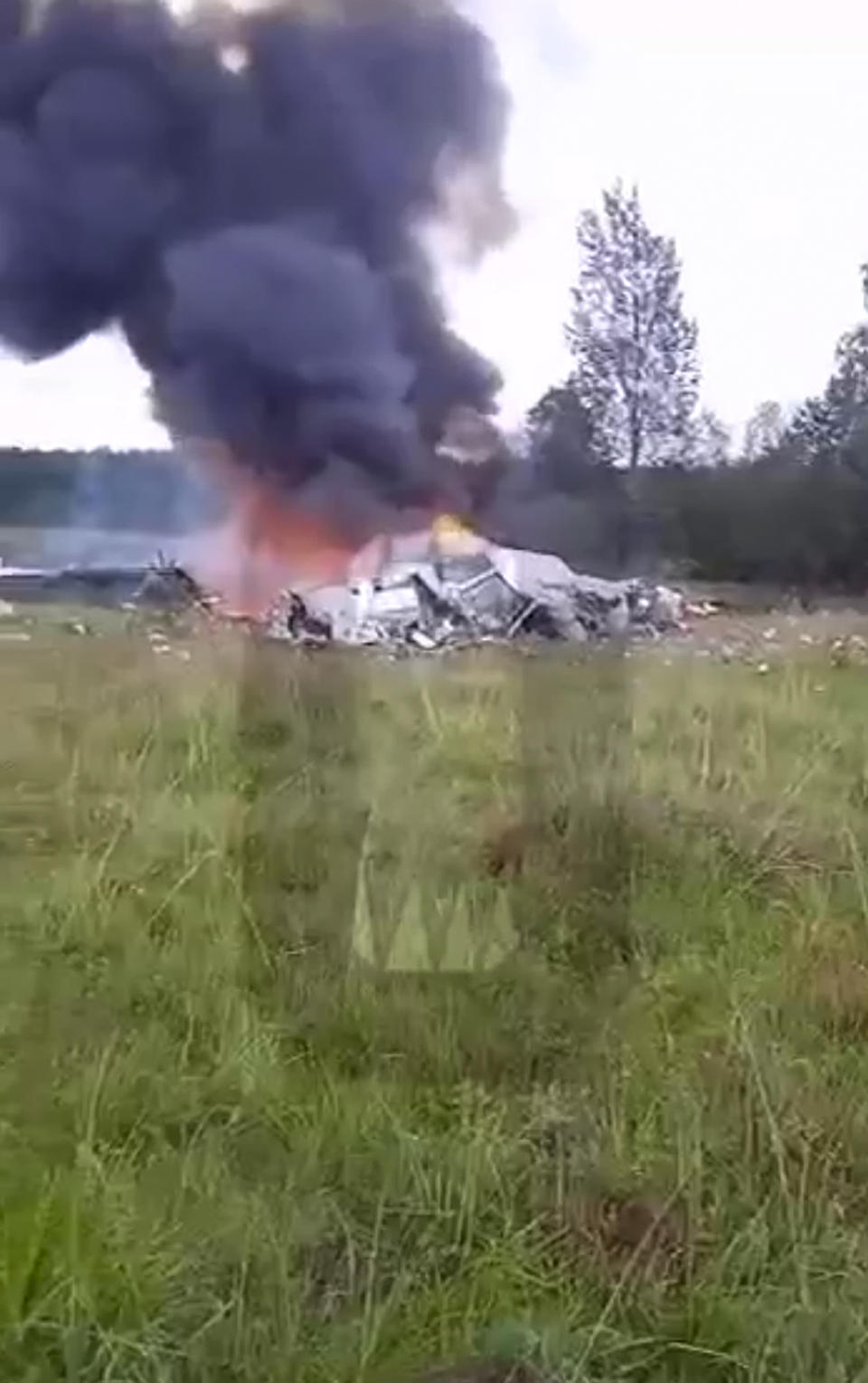 This image taken from video released by Ostorozhno Novosti on Wednesday, Aug. 23, 2023, shows the crash site of a private jet near the village of Kuzhenkino, Tver Region. Officials say a private jet has crashed over Russia, killing all 10 people on board. Mercenary chief Yevgeny Prigozhin was on the passenger list, but it wasn't immediately clear if he was on board. (Ostorozhno Novosti via AP)