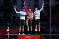 Primoz Roglic of Slovenia, centre, celebrates on the podium after winning La Vuelta cycling race alongside 2nd placed Alejandro Valverde of Spain, left and 3rd placed Tadej Pogacar of Slovenia in Madrid, Spain, Sunday, Sept. 15, 2019. (AP Photo/Manu Fernandez)