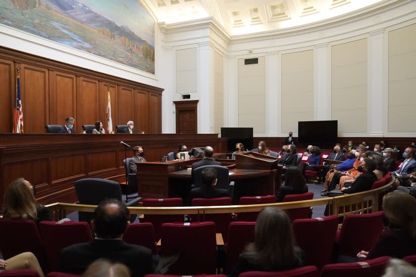 Attorney General of California Rob Bonta, from top left, Chief Justice of California Tani G. Cantil-Sakauye and Presiding Justice Manuel A. Ramirez speak during a public hearing held by the Commission on Judicial Appointments to consider the selection of Judge Kelli Evans to the California Supreme Court in San Francisco, Thursday, Nov. 10, 2022. Evans was approved Thursday by the Commission on Judicial Appointments. (AP Photo/Jeff Chiu, Pool)