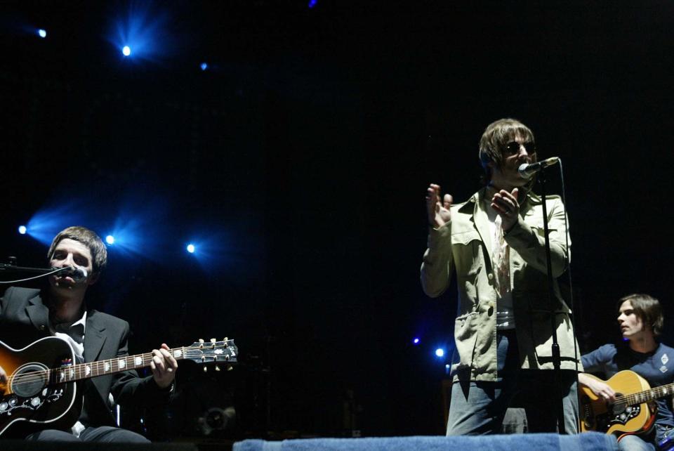 Liam and Noel Gallagher, Oasis performing live on stage at the Teenage Cancer Trust Concert held at the Royal Albert Hall in London. Live. Half Length.  ©Suzan/allaction.co.uk      