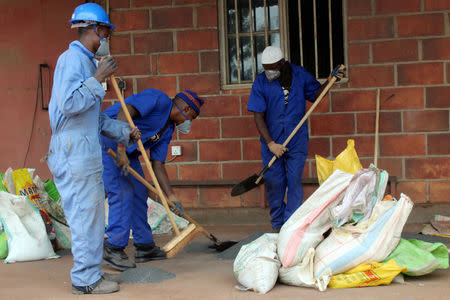 Power Resources Group (PRG) workers pack tantalum in bags at their warehouse in Kigali, Rwanda October 17, 2018. REUTERS/Clement Uwiringiyimana