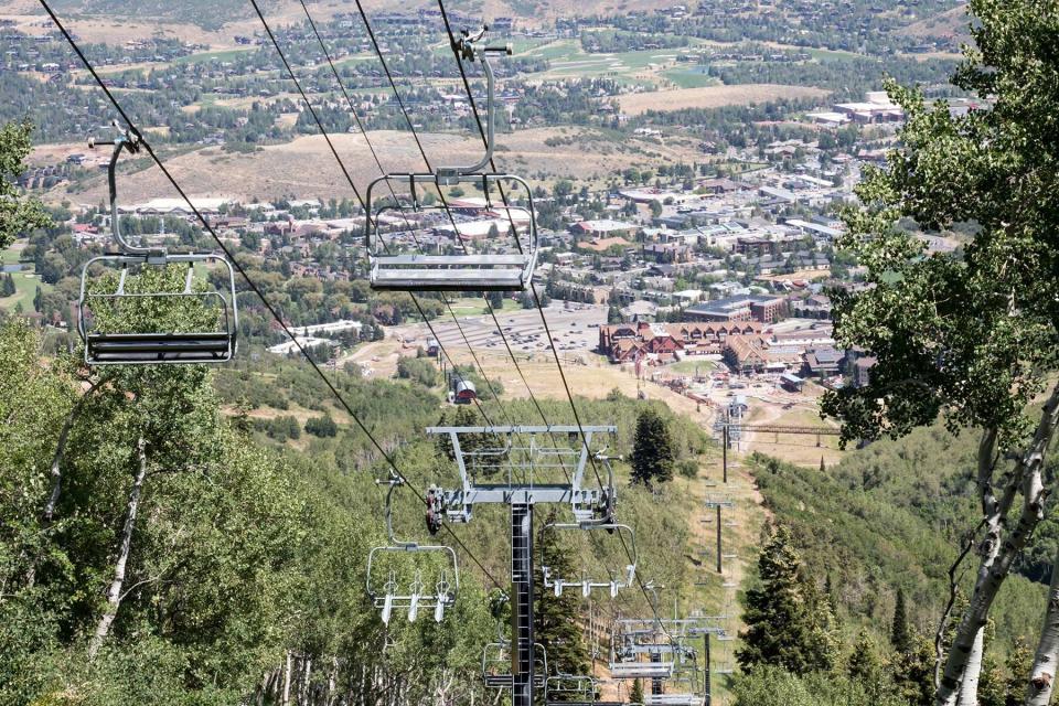 Park City, Utah ski lift among green trees