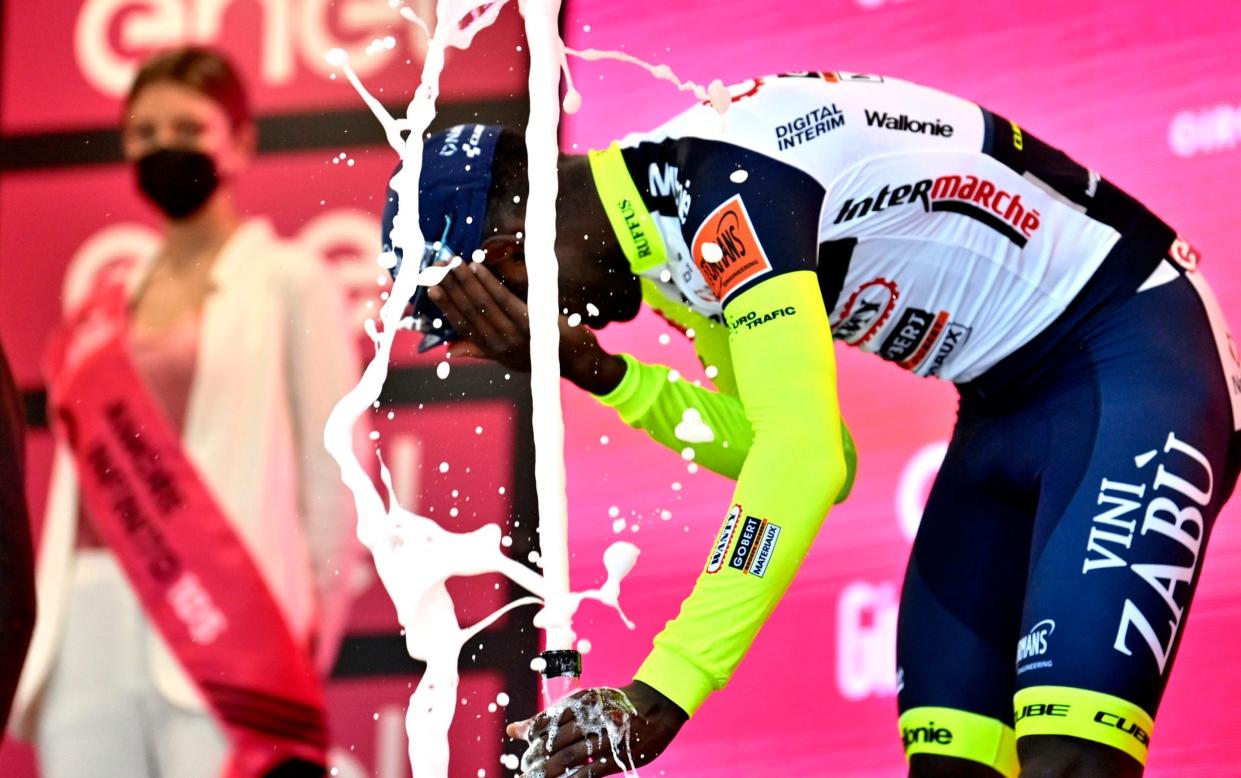 Watch: History-making cyclist out of Giro d'Italia after firing Prosecco cork into his own eye - AP