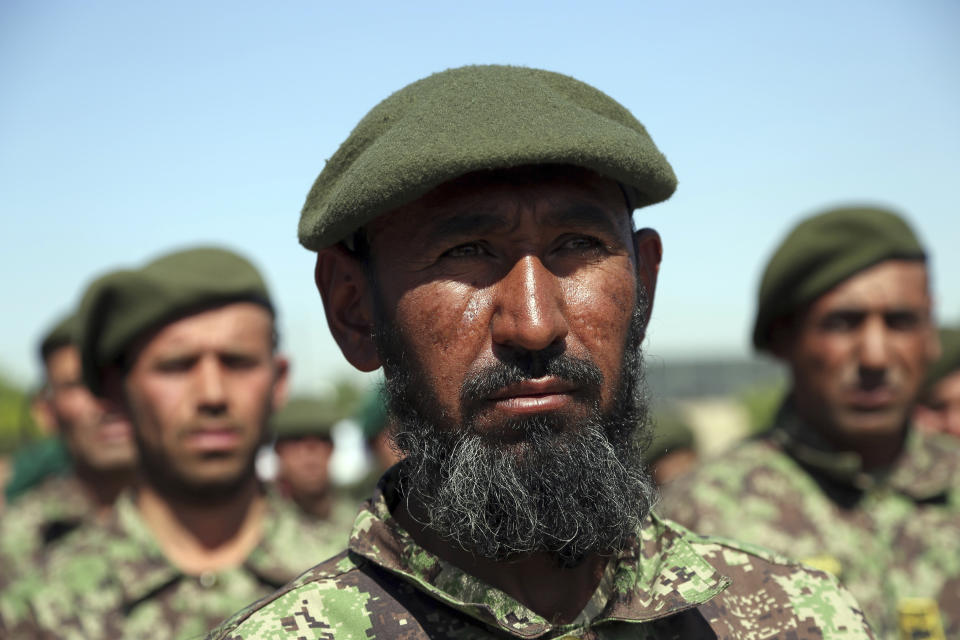 Afghan National Army members attend their graduation ceremony from a 3-month training program at the Afghan Military Academy in Kabul, Afghanistan, Monday, May 27, 2019. (AP Photo/Rahmat Gul)