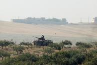 A Turkish army armoured vehicle is pictured in Karkamis on the Turkish-Syrian border in the southeastern Gaziantep province, Turkey, August 24, 2016. REUTERS/Stringer