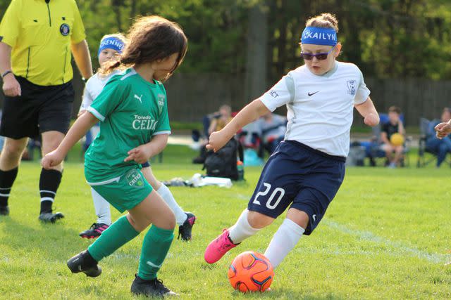 <p>Shauna Robison</p> Kailyn Bever playing soccer