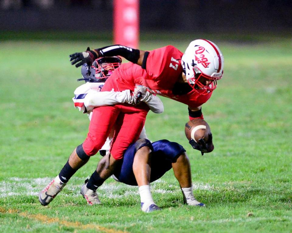 Ceres receiver Manuel Mendoza (17) gets taken down after catching a pass during a game between Ceres and Beyer at Ceres High School in Ceres California on September 22, 2023.