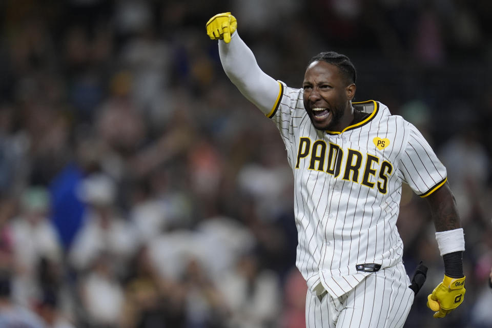 San Diego Padres' Jurickson Profar celebrates after hitting a two-RBI ground rule double to defeat the Washington Nationals during the tenth inning of a baseball game Monday, June 24, 2024, in San Diego. The Padres won, 7-6. (AP Photo/Gregory Bull)