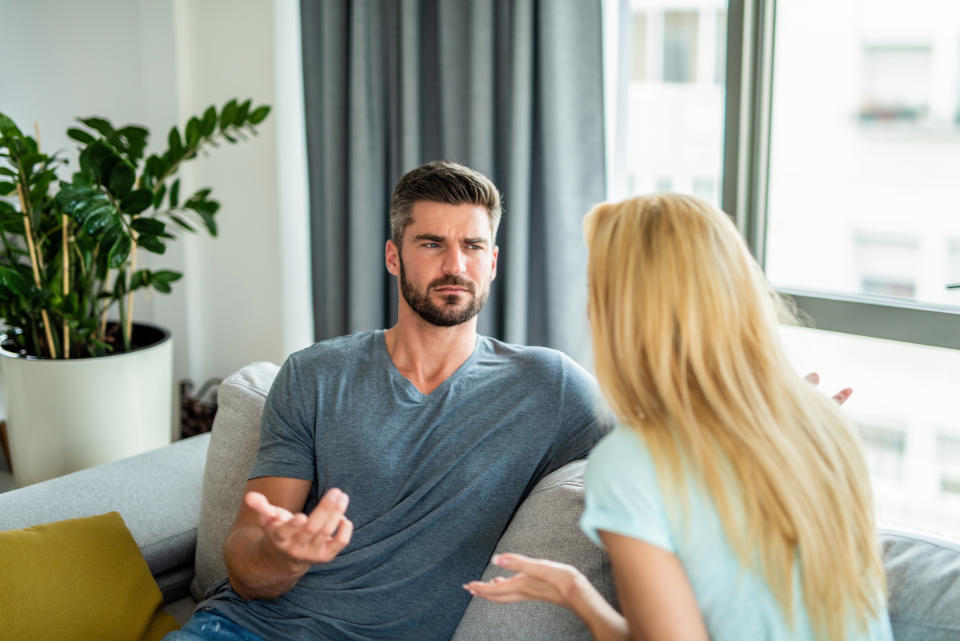 man questioningly looking at woman