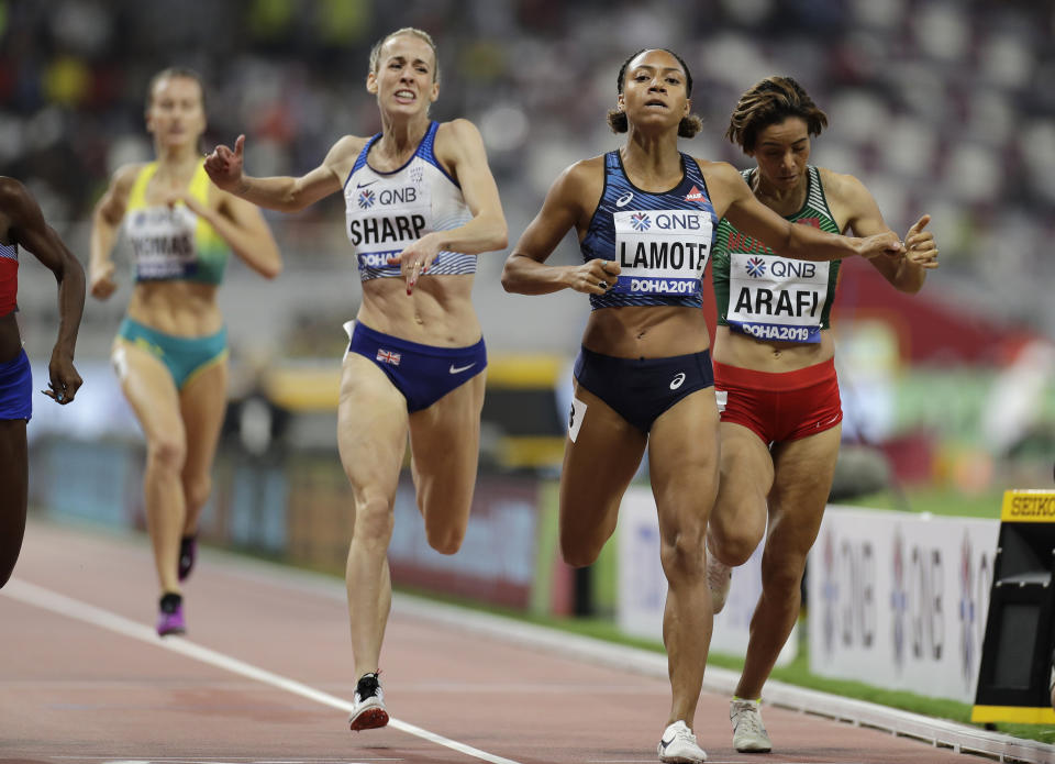 From right, Rababe Arafi of Morocco, Renelle Lamote of France and Britain's Lynsey Sharp compete during the women's 800 meters heats at the World Athletics Championships in Doha, Qatar, Friday, Sept. 27, 2019. (AP Photo/Petr David Josek)