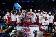 Florida Atlantic players celebrate after defeating Kansas State in an Elite 8 college basketball game in the NCAA Tournament's East Region final, Saturday, March 25, 2023, in New York. (AP Photo/Frank Franklin II)