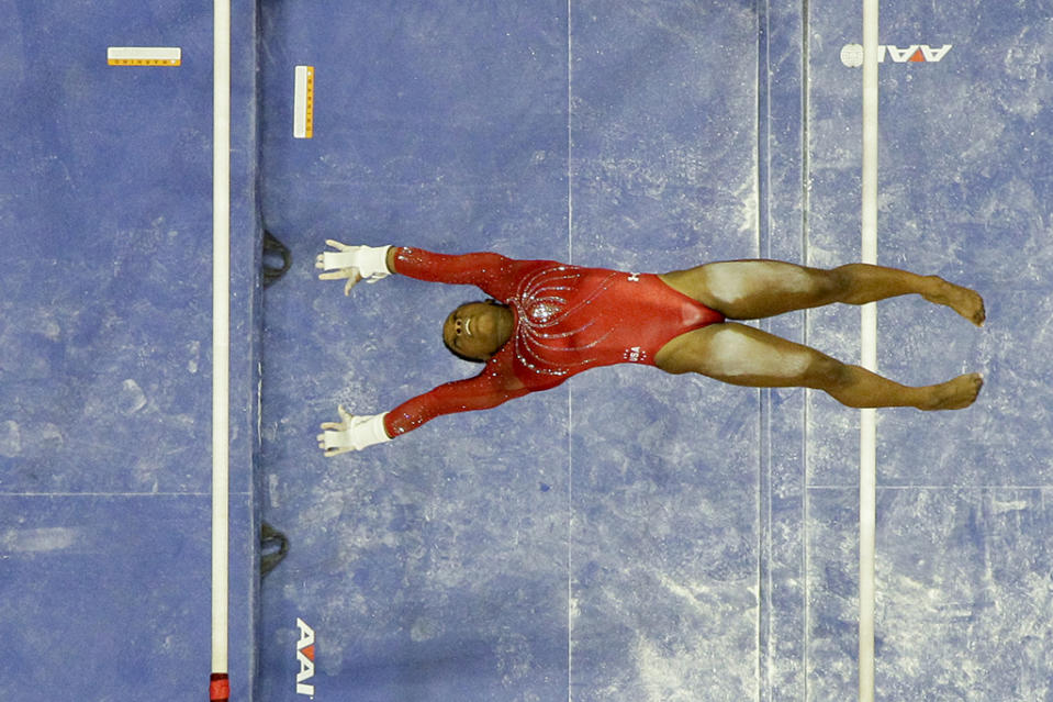 <p>Simone Biles competes on the uneven bars during the women’s U.S. Olympic gymnastics trials in San Jose, Calif., on July 10, 2016. </p>