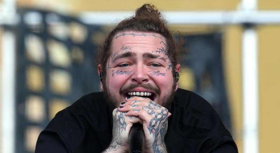 Post Malone has been the true face (get it?) of tattoos above the neck. (Photo by Simone Joyner/Getty Images)