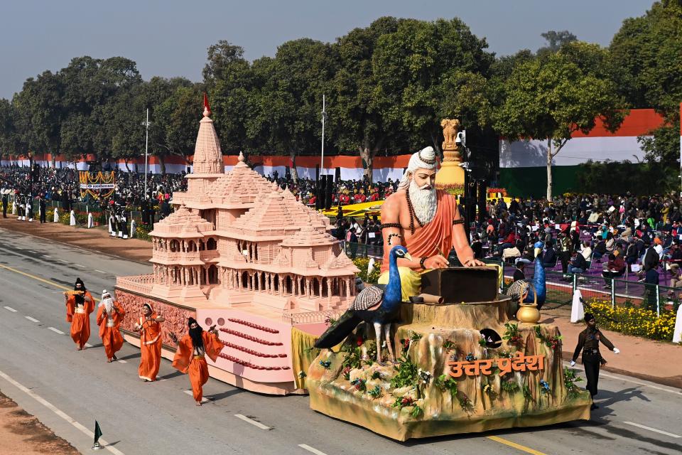 Performers dance next to a float representing Uttar Pradesh state on Rajpath during the Republic Day parade in New Delhi on January 26, 2021. (Photo by Jewel SAMAD / AFP) (Photo by JEWEL SAMAD/AFP via Getty Images)