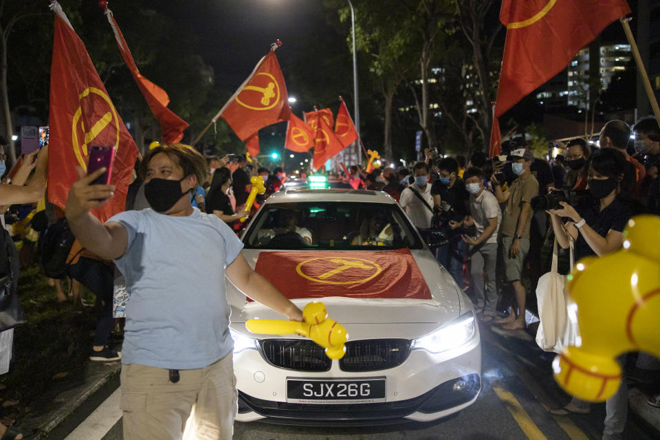  Supporters of the Workers' Party cheering at Hougang Avenue 5 in the early hours of 11 July, 2020, hours after the GE2020 polls have ended.  (PHOTO: Don Wong for Yahoo News Singapore)