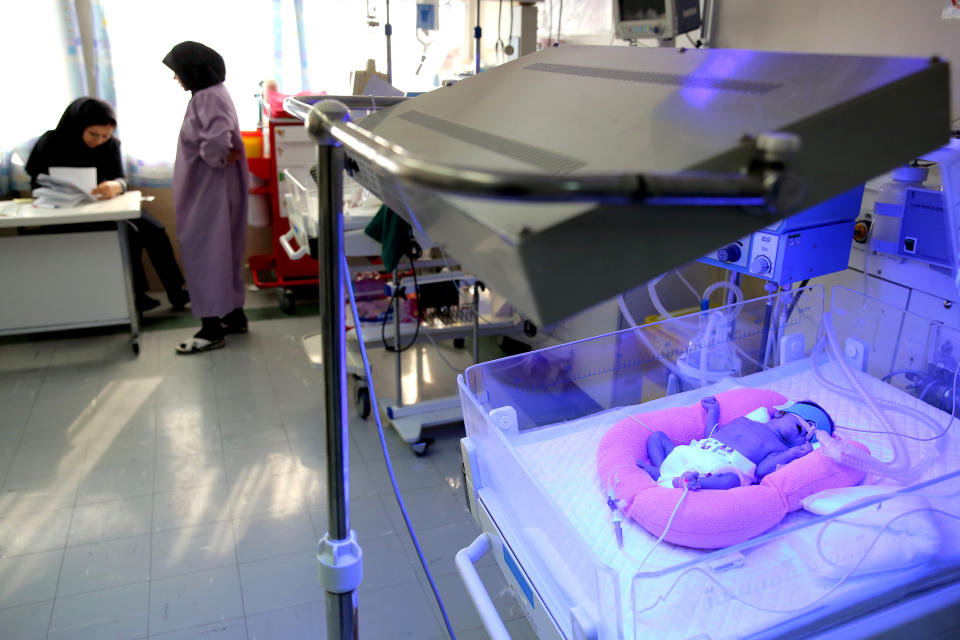 In this Monday, Dec. 30, 2013 photo, a premature baby sleeps under a photo-therapy light used to treat jaundice at the Neonatal Intensive Care Unit of the Mofid Children's Hospital in Tehran, Iran. (AP Photo/Ebrahim Noroozi)