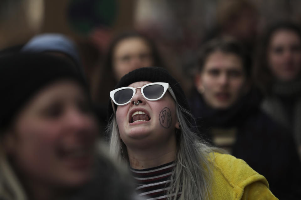 A young woman shouts slogans as she marches with others during a climate change protest in Brussels, Thursday, Jan. 31, 2019. Thousands of teenagers in Belgium have skipped school for the fourth week in a row in an attempt to push authorities into providing better protection for the world's climate. (AP Photo/Francisco Seco)