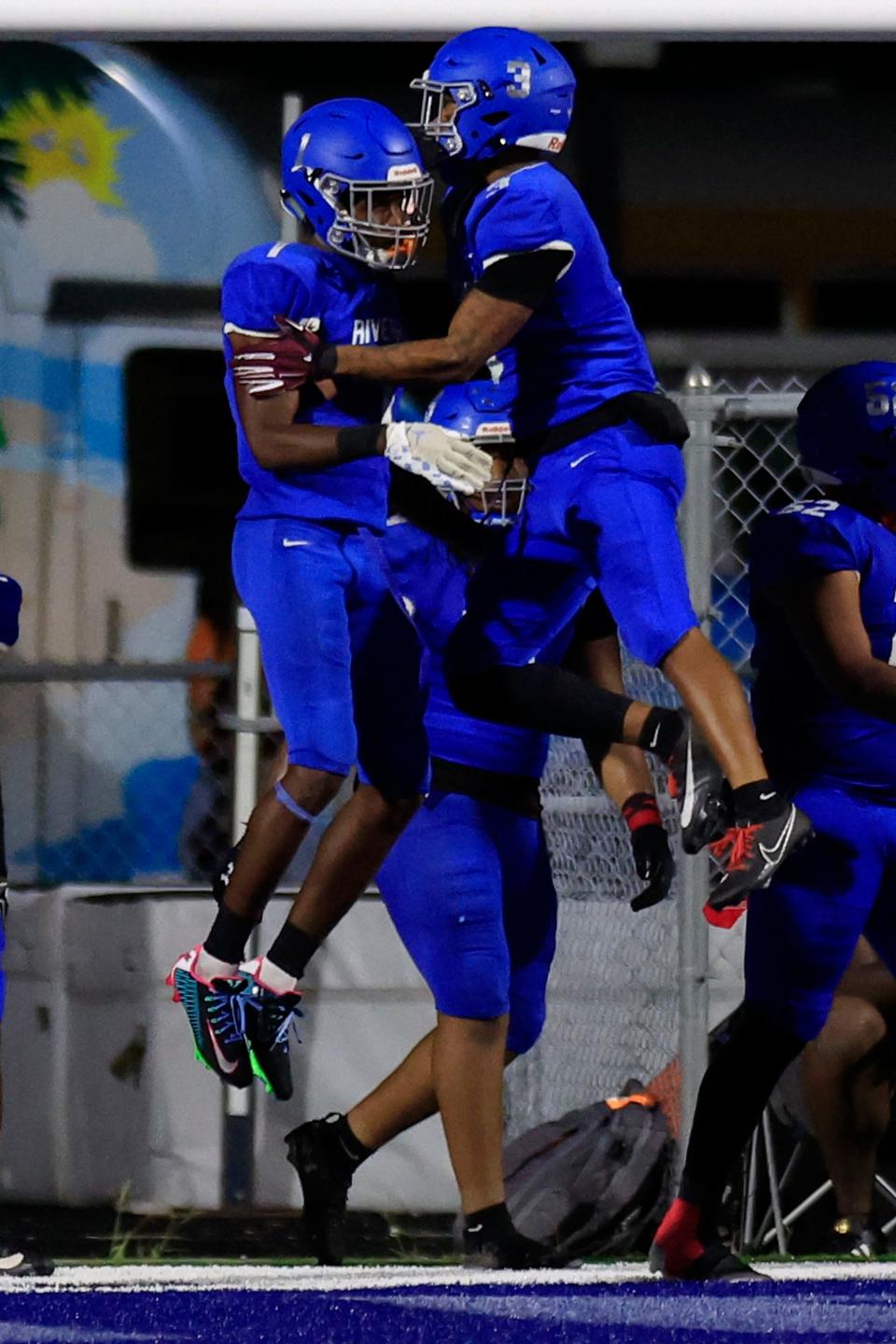 Riverside's Myles Kendrick (1), left, celebrates his touchdown score with Kaiden Morris (3) during the third quarter of a high school football matchup Friday, Sept. 22, 2023 at Riverside High School in Jacksonville, Fla. The Riverside Generals defeated the Ed White Commanders 32-20.