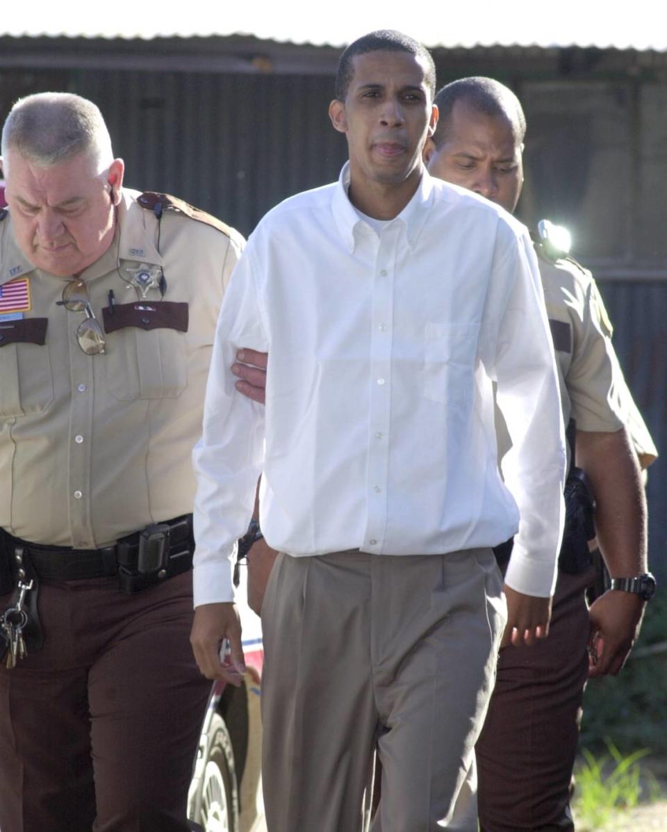 Rapper Mac, whose real name is McKinley Phipps, is escorted into the St. Tammany Parish Courthouse in Covington on Monday, Sept. 10, 2001, before the start of his second-degree murder trial.