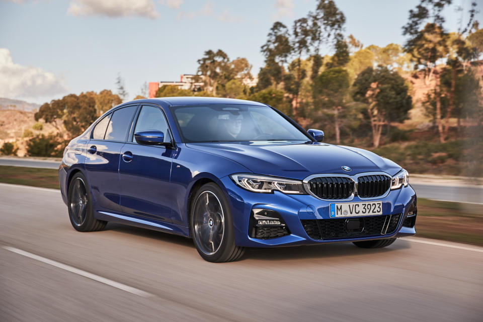 A blue 2020 BMW 330i, a compact luxury-sports sedan.