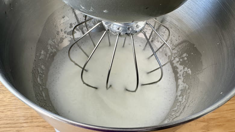 Egg whites whipping in stand mixer bowl
