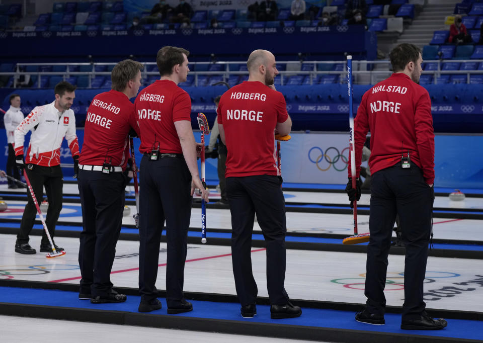 From right, Norway's Steffen Walstad, Markus Hoeiberg, Magnus Vaagberg, Torger Nergaard, compete, during the men's curling match against Switzerland, at the 2022 Winter Olympics, Wednesday, Feb. 9, 2022, in Beijing. (AP Photo/Nariman El-Mofty)