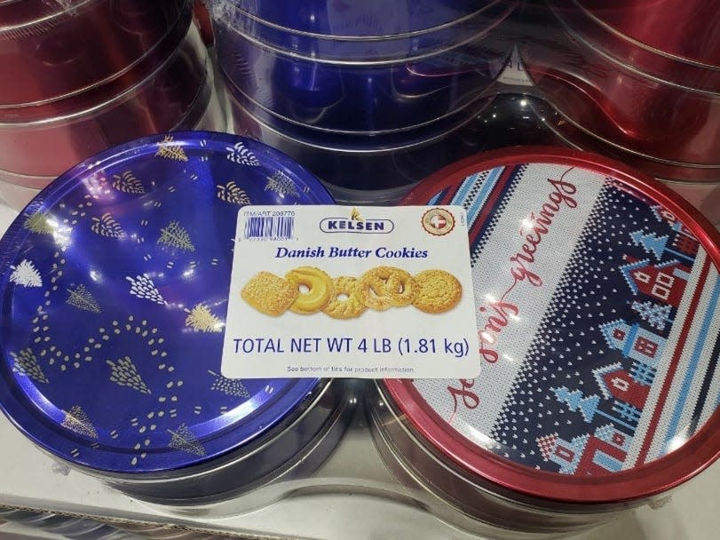 blue and red, white, and light blue tins of danish butter cookies wrapped in plastic at Costco