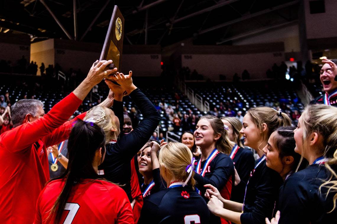 The Panthers rush the trophy after Colleyville Heritage beat Frisco Reedy in the 5A state final at the Curtis Culwell Center in Garland on November 19th, 2022.