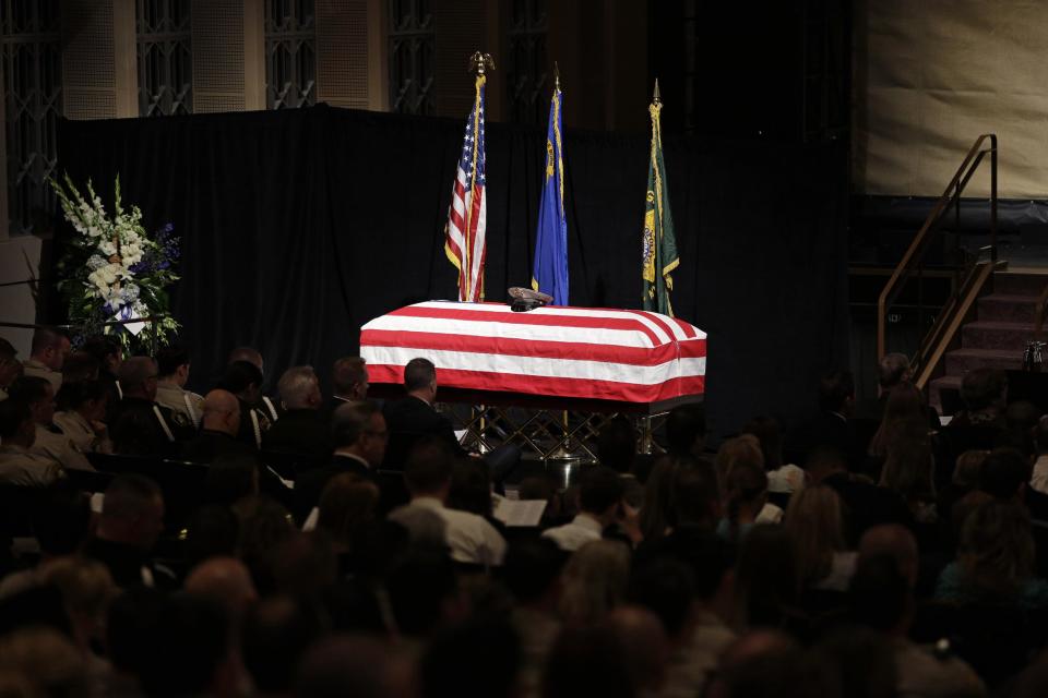 A flag covers the casket of Las Vegas Metropolitan Police Officer Alyn Beck, 41, at his funeral in June. (AP Photo/John Locher, Pool)