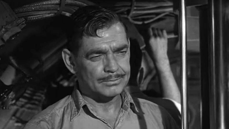 Close up of Clarke Gable in a submarine