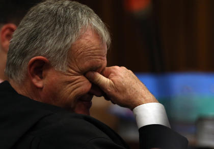 Defense lawyer for Oscar Pistorius, Barry Roux, reacts as he listens to evidence in court. (AP)