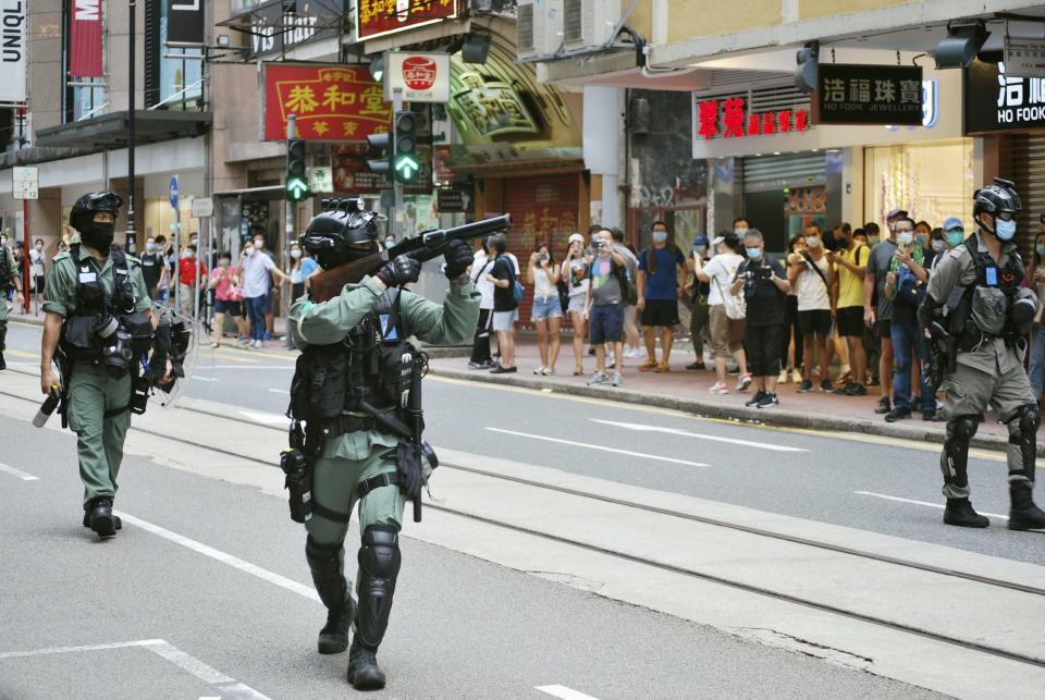 hong kong police riot guns