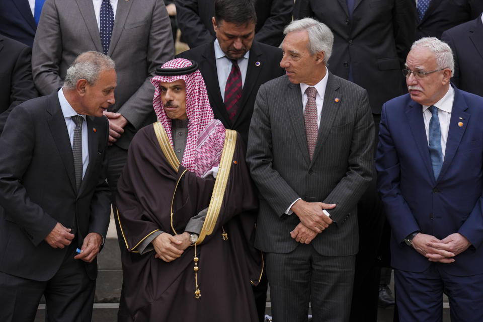 From left to right: Secretary General of the Union for the Mediterranean Nasser Kamel, Ministry of Foreign Affairs of Saudi Arabia Prince Faisal bin Farhan Al-Saud, Portugal's Foreign Minister Joao Gomes Cravinho, Palestinian Foreign Minister Riad al-Malki during a family picture with members of European Union member states, Middle East and northern Africa countries at the Union for the Mediterranean event in Barcelona, Spain, Monday, Nov. 27, 2023. (AP Photo/Emilio Morenatti)