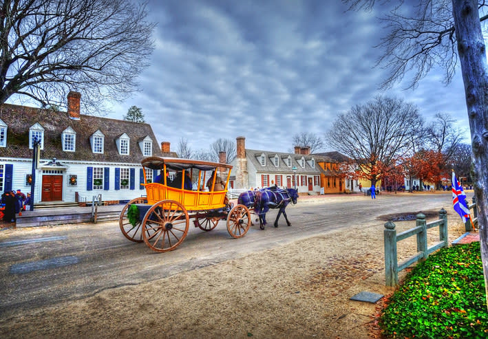 a horse and carriage in a small town