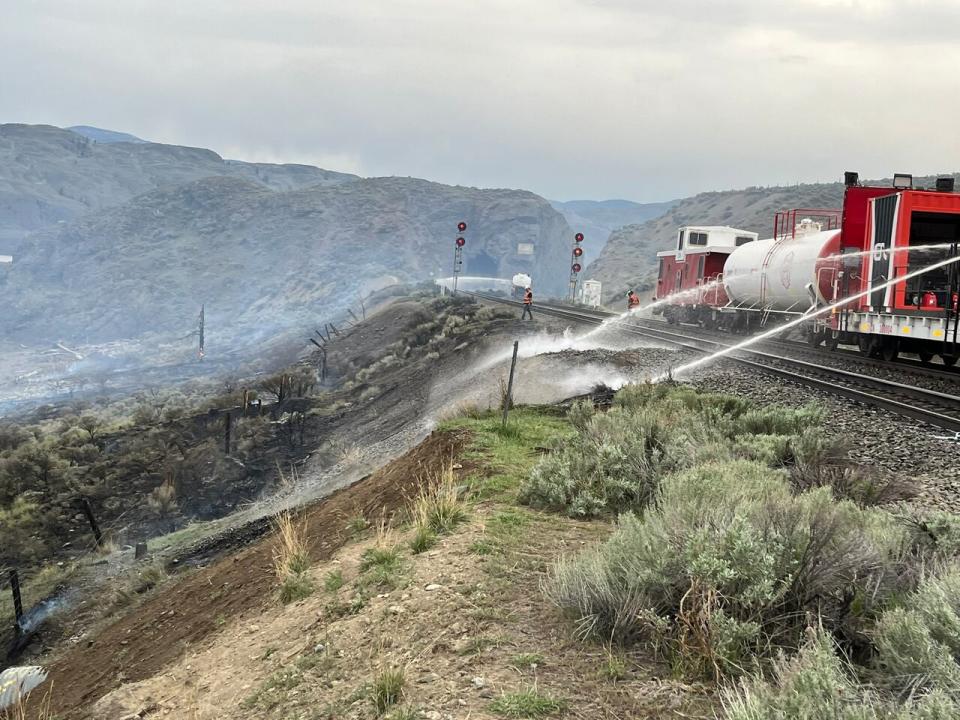 A firefighting train from CN Railway is pictured at the scene of a grass fire near Kamloops, B.C., on Saturday, April 20, 2024.