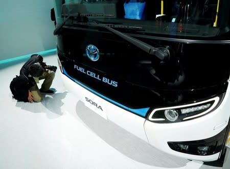 FILE PHOTO: Toyota Motor Corp. displays the company's fuel cell bus Sora during media preview of the 45th Tokyo Motor Show in Tokyo