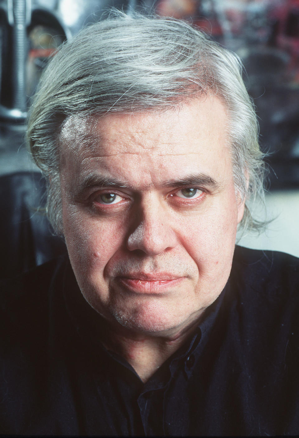 FILE - In this 1995 file picture Swiss artist H.R. Giger is photographed at his house in Zurich, Switzerland. H.R. Giger, who designed the creature in Ridley Scott's sci-fi horror classic "Alien," has died at age 74 from injuries suffered in a fall. Sandra Mivelaz, administrator of the H.R. Giger museum in Chateau St. Germain told The Associated Press Tuesday May 13, 2014 that Giger had died in a hospital the day before. Giger received a 1979 Academy Award for special effects in 'Alen'. (AP Photo/Keystone, Martin Ruetschi, file) ONE TIME USE ONLY