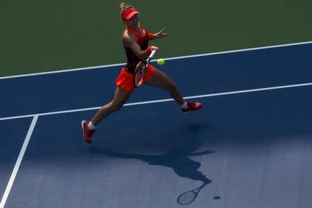 Simona Halep of Romania chases down a return to Kateryna Bondarenko of Ukraine during their second round match at the U.S. Open Championships tennis tournament in New York, September 3, 2015. REUTERS/Brendan McDermid