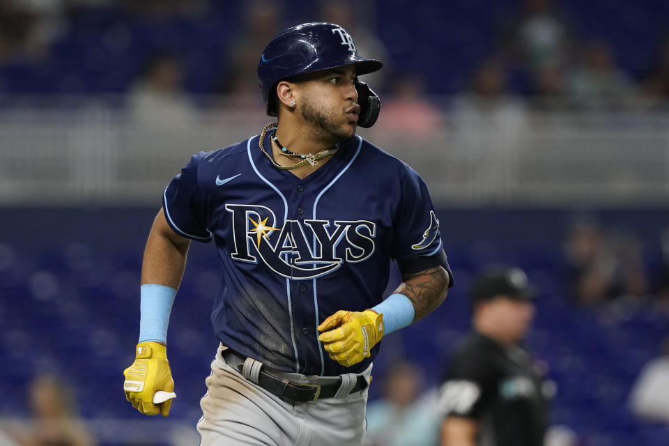 Tampa Bay Rays' Jose Siri (22) hits a home run in the seventh inning of a baseball game against the Miami Marlins, Tuesday, Aug. 30, 2022, in Miami. (AP Photo/Marta Lavandier)