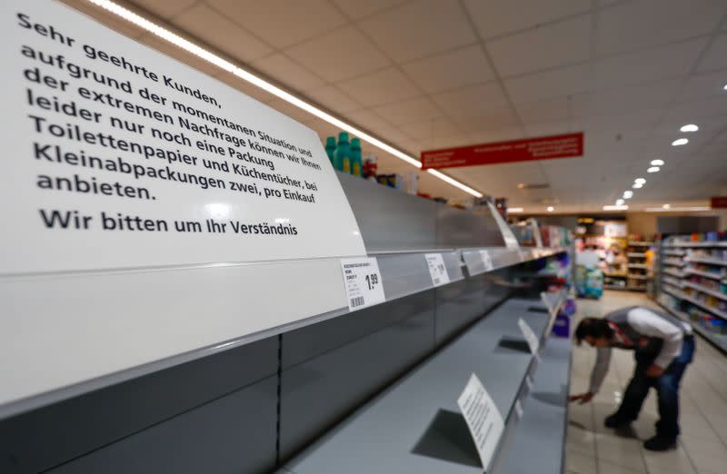 FILE PHOTO: A sign announces the rationing of toilet paper to one pack per person at a Rewe grocery store in Potsdam