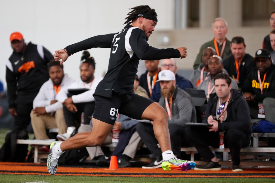 OSU safety Jason Taylor, a Carl Albert alum, sprints during a workout for NFL scouts Wednesday at the Cowboys' Pro Day in Stillwater.