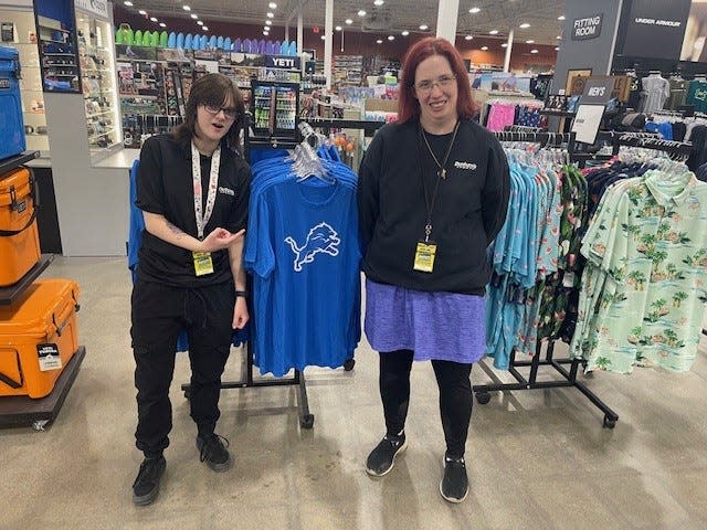 Cashiers Sarah Harju, left, and Katie Clouse, right, seen here Friday said shoppers from the U.S. and Canada are stopping at Dunham's Sports in Fort Gratiot Township store to stock up on swag before going downtown to the NFL Draft. Jared Goff jerseys are sold out.