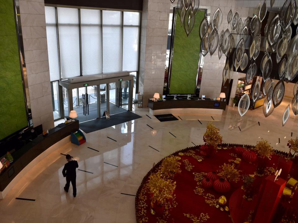 The hotel lobby is pictured deserted as guests and visitors stay away due to the SARS-like virus affecting the city of Wuhan in Hubei province on January 29, 2020.