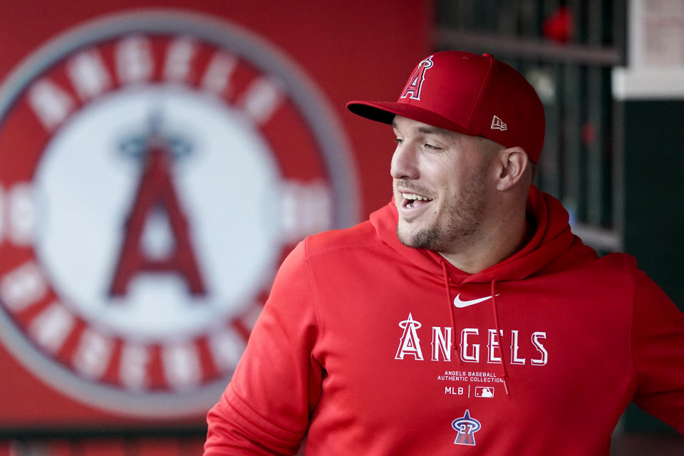 Los Angeles Angels center fielder Mike Trout stands in the dugout before a baseball game against the Philadelphia Phillies, Tuesday, April 30, 2024, in Anaheim, Calif. (AP Photo/Ryan Sun)