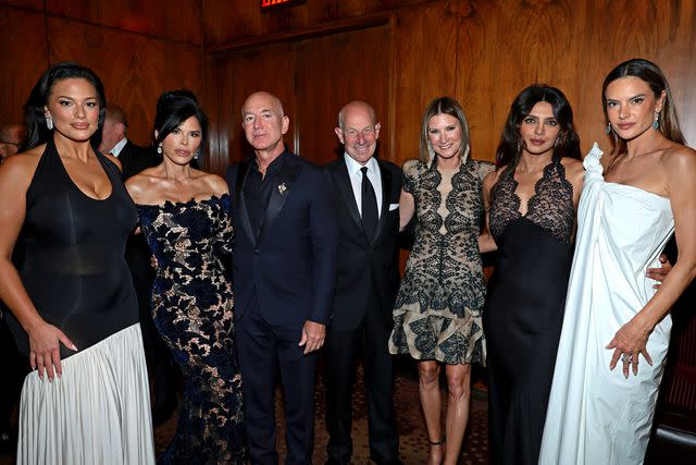 <p>Dimitrios Kambouris/Getty</p> (L-R) Ashley Graham, Lauren Sanchez, Jeff Bezos, Jonathan Tisch, Lizzie Tisch, Priyanka Chopra Jonas and Alessandra Ambrosio attend the Kering Foundation Third Annual Caring For Women Dinne