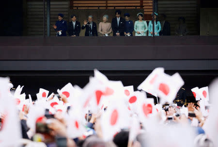 FILE PHOTO : Japan's Emperor Akihito, flanked by Empress Michiko, Crown Prince Naruhito, Crown Princess Masako, Prince Akishino, Princess Kiko, Princess Mako and Princess Kako wave to well-wishers who gathered to celebrate the emperor's 85th birthday at the Imperial Palace in Tokyo, Japan December 23, 2018. REUTERS/Issei Kato/File Photo