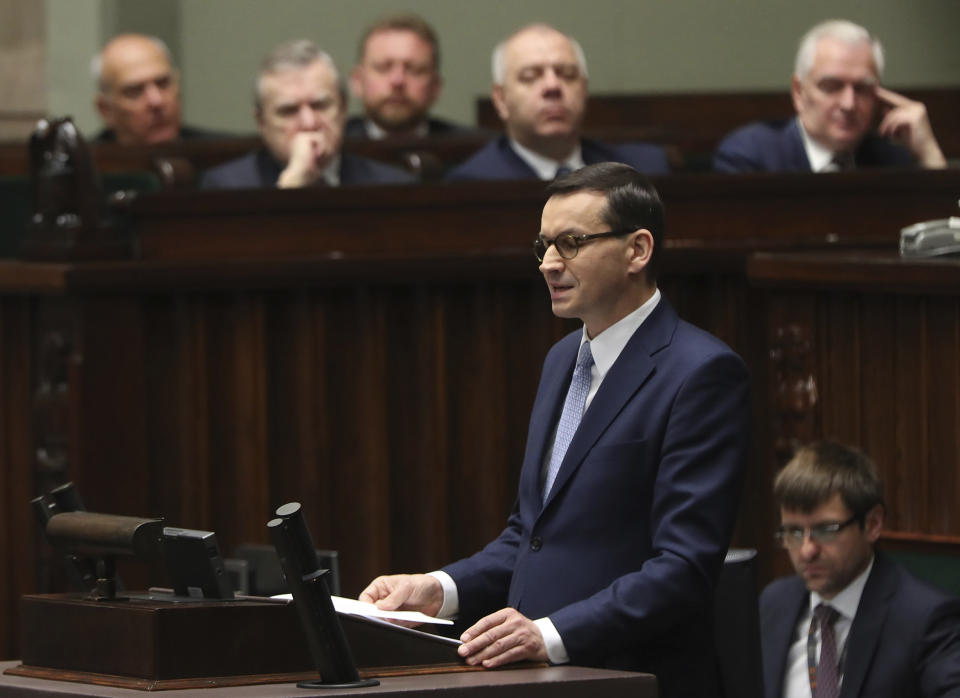 Poland's Prime Minister Mateusz Morawiecki vows to protect U.S. – EU ties and the crucial role of NATO, against criticism from some other European leaders, during his policy speech for his second term in office following October parliamentary elections, in Warsaw, Poland, Tuesday, Nov. 19, 2019. (AP Photo/Czarek Sokolowski)