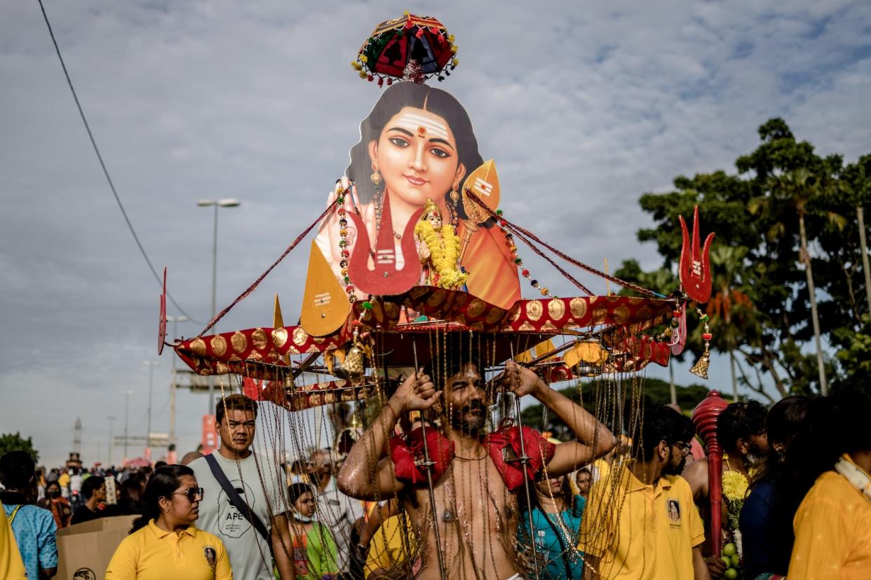 A man carrying the kavadi during Thaipusam in Malaysia.